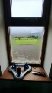 Broken window before glass replacement in Tipperary